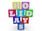 HOLIDAYS concept on different colored toy blocks