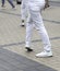 Holidays concept.Fragment photo of women legs in the street. Unknown unrecognizable women performing during line dance festival in