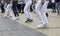 Holidays concept.Fragment photo of women legs in the street. Unknown unrecognizable women performing during line dance festival in