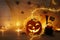 Holidays halloween concept image. Pumpkin, spiders over wooden table