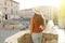 Holidays in Italy. Back view of young woman visiting a typical medieval city of Umbria region. Girl visiting the city of Perugia