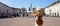 Holidays in Italy. Panoramic view of traveler girl walking in Piazza San Carlo square enjoying cityscape of Turin, Italy. Young