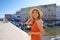 Holidays in Italy. Portrait of tourist woman in the historic town and port of Monopoli, Apulia, Italy