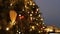 Holidays in Moscow. In the square a Christmas tree glows, decorated with balls and beautiful Christmas toys close-up.