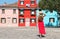 Holidays in Venice, Italy. Attractive girl strolling in Burano village, Venice, Italy