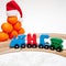 Holidays, winter and celebration concept - Christmas composition Russian wooden letters train cars the word New Year on wood railw