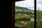 Holistay house. Countryside hiking. Window. Vacation landscape. Russian Altai