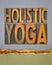 holistic yoga word abstract - text in letterpress wood type on art paper, vertical poster