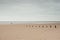 Holkham, Norfolk, UK: Vast empty beach and horizon under winter sky