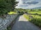 Holl Gate, with fields, dry stone walls, and farms in, West Witton, Leyburn, UK