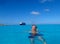 The Holland America Line Zuiderdam cruise ship anchored off the private island of Half Moon Cay in the Bahamas on a sunny day with