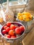 Holland Cherry Tomato in metal bucket placed on wood table