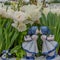 Holland hand-painted ceramic figures Delft blue kissing boy girl. Typical dutch girl and boy