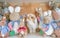 Holland Lop rabbit disguises among other soft plush doll rabbit characters from Peter Rabbit