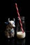 Holland porcelain cow and bottle with milk, red and white striped straw.