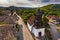 Holloko, Hungary - Aerial view of the traditional catholic church of Holloko at the village centre, an UNESCO site in Hungary