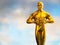 Hollywood Golden Oscar Academy award statue. Success and victory concept.