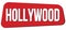 HOLLYWOOD text on red trapeze stamp sign