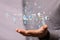 Hologram of binary codes on the palm of a businessman - digital transformation concept