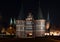 Holstentor and church towers in Luebeck iluminated at night, med