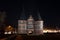 Holstentor in Luebeck at night, the medieval city gate is a popular tourist attraction of the historic old town in