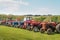 HOLSWORTHY, DEVON, ENGLAND - MAY 30 2021: Lineup of many different vintage tractors, agricultural vehicles at rally.