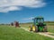 HOLSWORTHY, DEVON, ENGLAND - MAY 30 2021: Many different vintage tractors, agricultural vehicles at rally. Rear view.