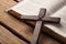 Holy Bible book and cross on wooden background