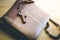 Holy bible and rosary: Christian bible and rosary on a wooden desk