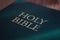 Holy Bible title closeup in sunlight. Religion and faith concept. Religious literature. Bible .