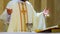 Holy communion on wooden table in church cup of glass with red wine, bread, prayer for wine