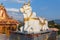 Holy cow statue sit in front of The statue of Lord Shiva at Siddhesvara Dhaam in Namchi. Sikkim, India