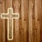 Holy cross on abstract wooden background