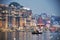 Holy Ganges river at Varanasi with rowing boat and seagulls