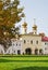 Holy gates of the Tikhvin Assumption Monastery in autumn