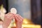 Holy host in the hands of the priest on the altar during the celebration of the mass