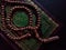 Holy islamic book quran closed and rosary beads