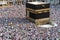 The Holy Kaaba. Crowd of people walking around Kaaba. Tawaf part during Umrah or Hajj