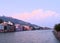 The Holy River Ganges - Ganga with Buildings, Temples, and Ghats on Banks and Cloudy Blue Sky - Haridwar, Uttarakhand, India