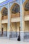 Holy Shrine of Shah Cheragh, muslim woman talking on phone.