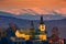 Holy Spirit church in Sielnica village with Low Tatras mountains on horizont during winter sunset