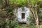 The holy spring of living water, the old 17th century font, moss-covered walls, autumn. Well of holy water with spring water, well