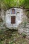 The holy spring of living water, the old 17th century font, moss-covered walls, autumn. Well of holy water with spring water, well