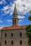 The Holy Trinity church in the medieval Budva Old Town with clouded skies in the background in Montenegro, Balkans