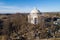 Holy Trinity Church in Suderve, Vilnius district, Lithuania. Cemetery in foreground. Drone