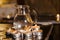 Holy water is heated by candles on a pedestal in a church for the rite of christening of a child