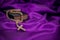 Holy week Bible rosary beads on purple background