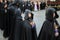 Holy Week in Zamora, Spain, procession of the Ladies of the Virgen de la Soledad, young lady with a serious gesture parading.