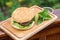 Homamade beef or pork hamburger with vegetable on chopping board with basil leaf in garden, food photoraphy