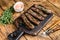 Homamade grilled Lula kebab meat sausages on a cutting board. wooden background. Top view